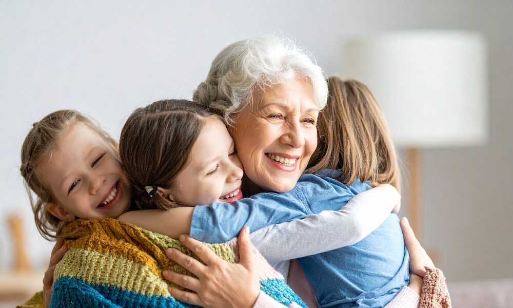 Firefly_senior hugging grandkids 452656 medicare